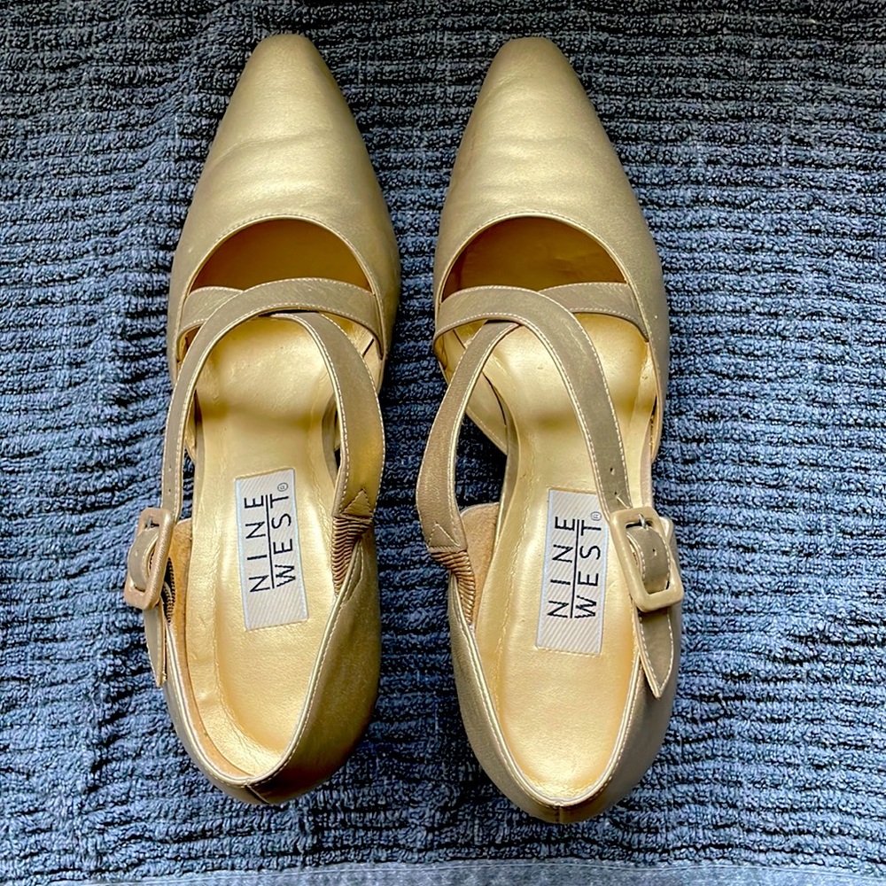 Nine west. Leather with Crisscross strap. Gold size 9. 3 inch heel. No heel wear
